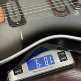 Powers Electric A-Type Silverburst FF42 on scale displaying weight.