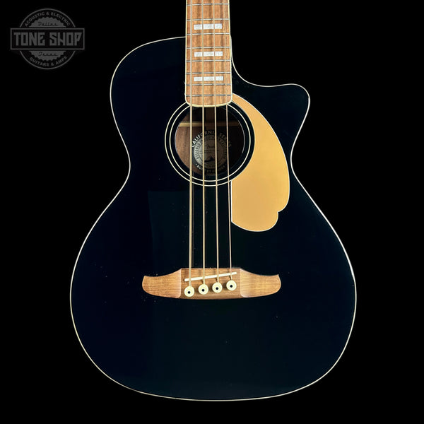 A dark navy blue acoustic guitar with a natural wood body, soundhole surround, and bridge, shown against a solid black background. A Tone Shop watermark is visible in the top-left corner.