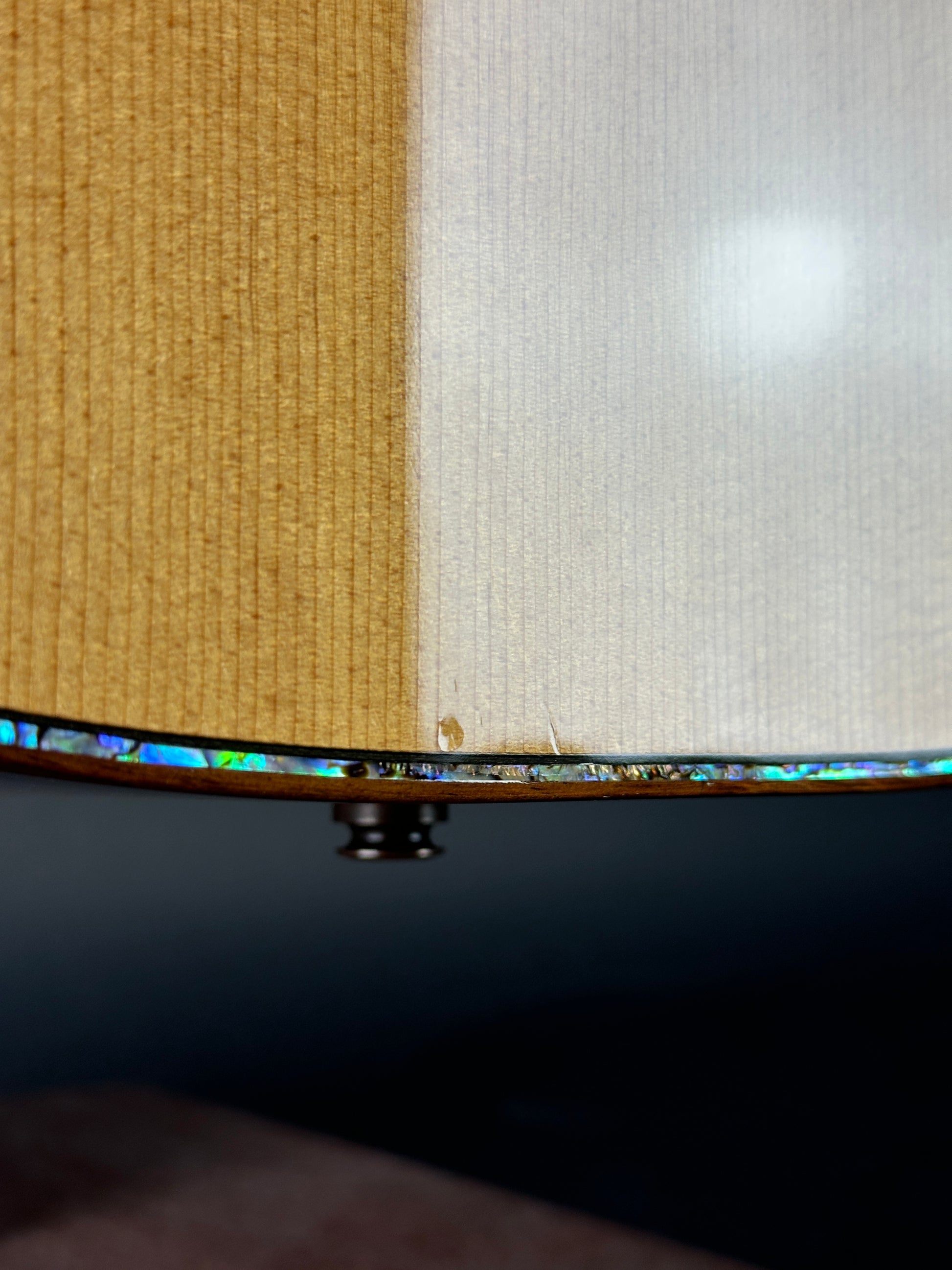 Close-up of a fabric texture with a gradient from white to beige.