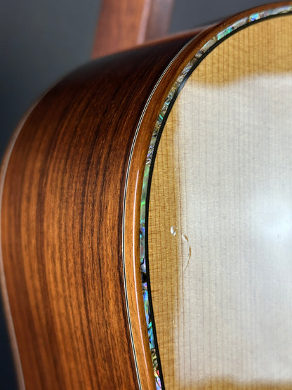 Close-up of a wooden guitar with a clear finish