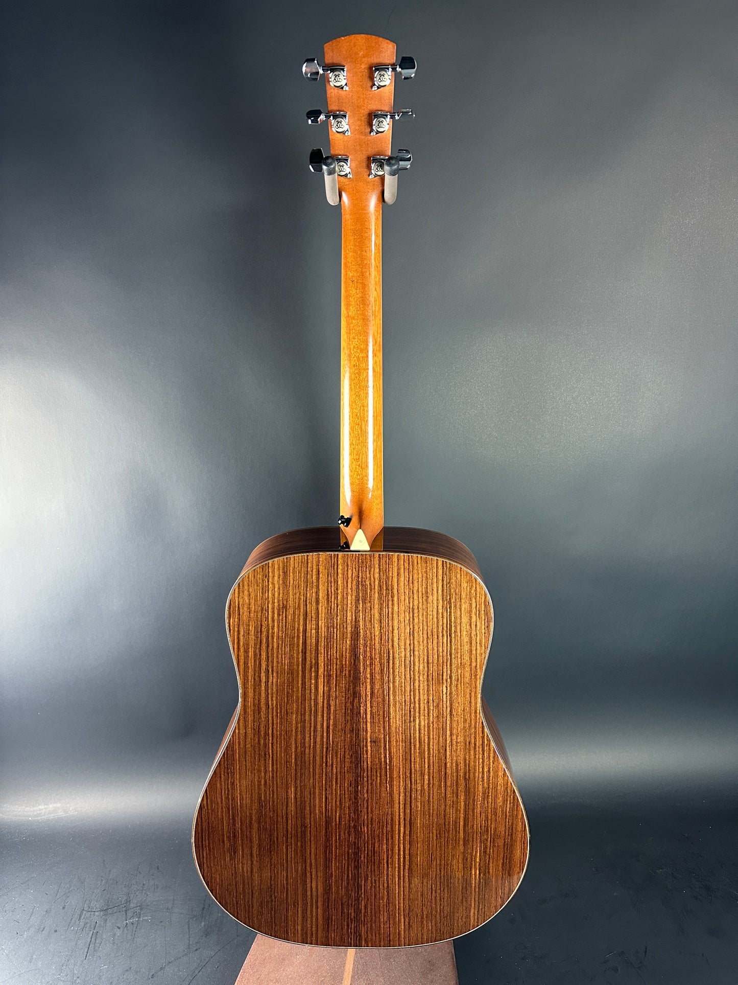 Acoustic guitar on a dark gray background