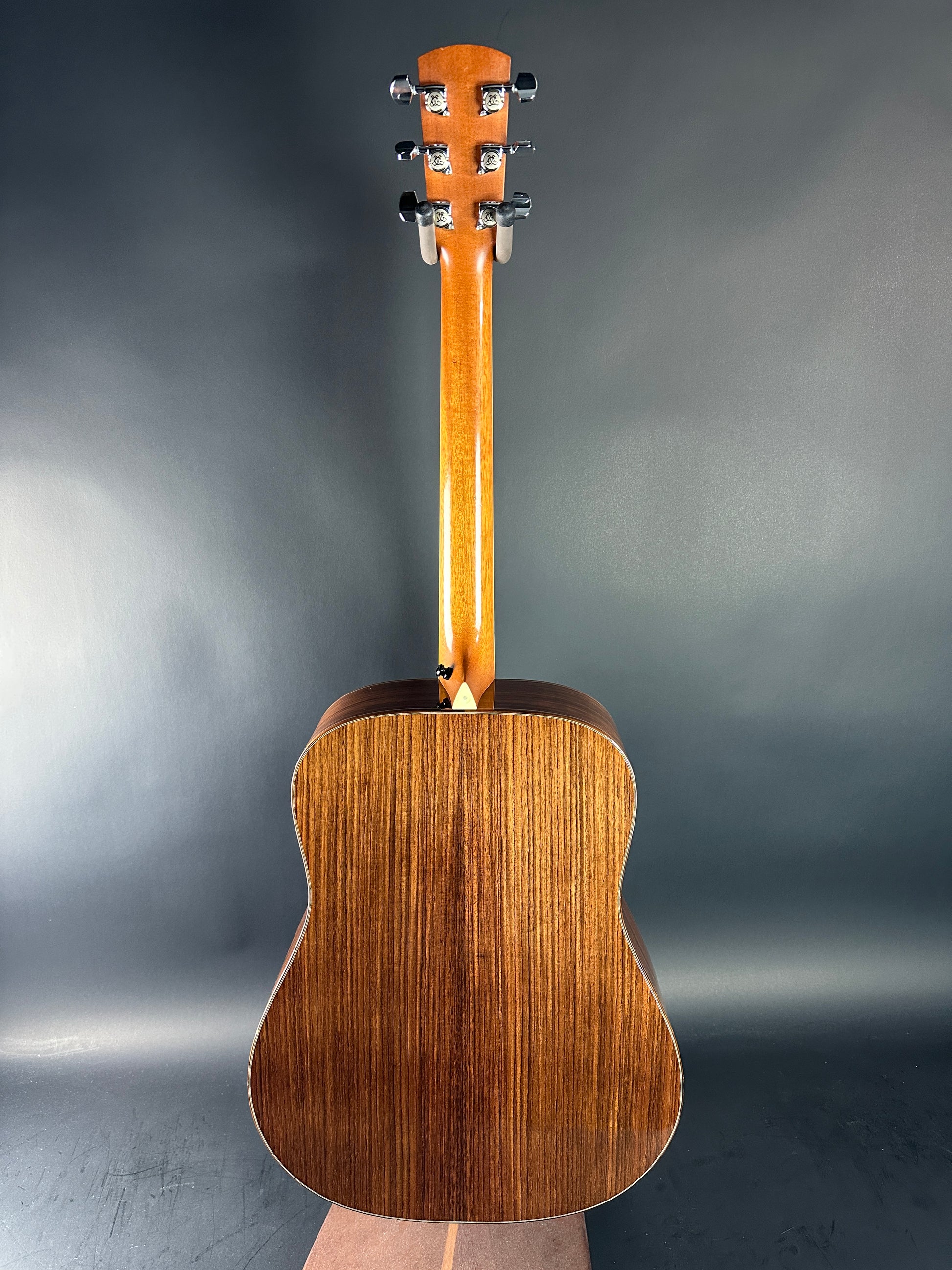 Acoustic guitar on a dark gray background