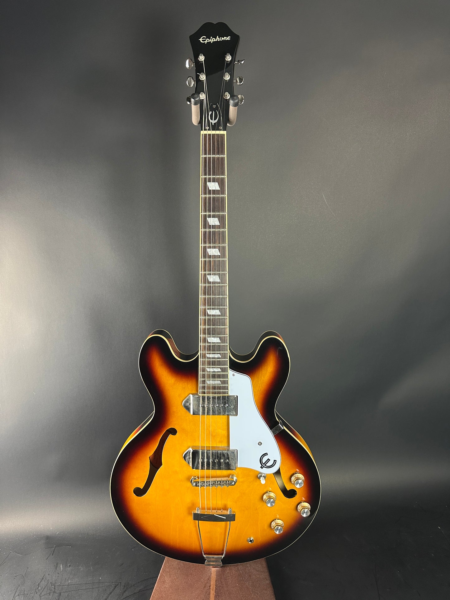 Electric guitar with a sunburst finish on a gray background
