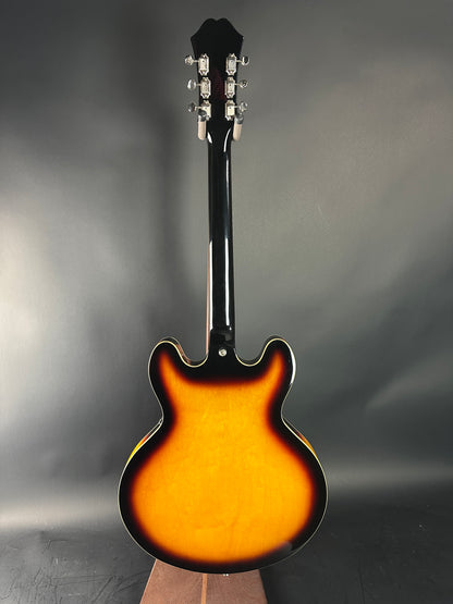 Electric guitar with a sunburst finish on a gray background
