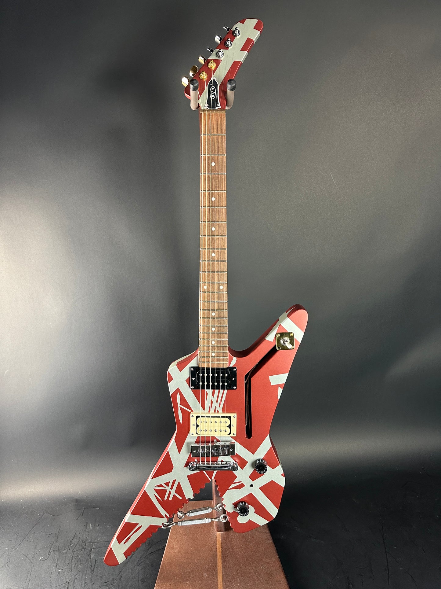 Electric guitar with a distinctive design on a dark background