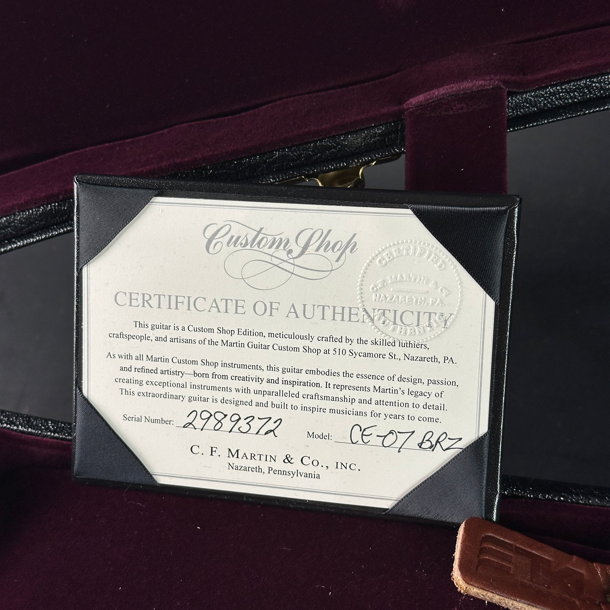 Certificate of Authenticity for a C.F. Martin guitar on a dark background