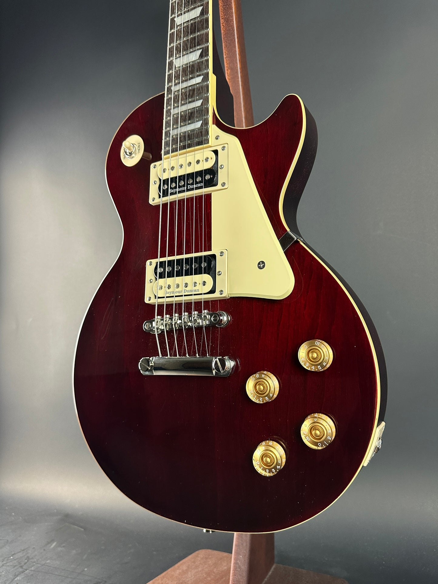 Electric guitar with a glossy finish on a gray background