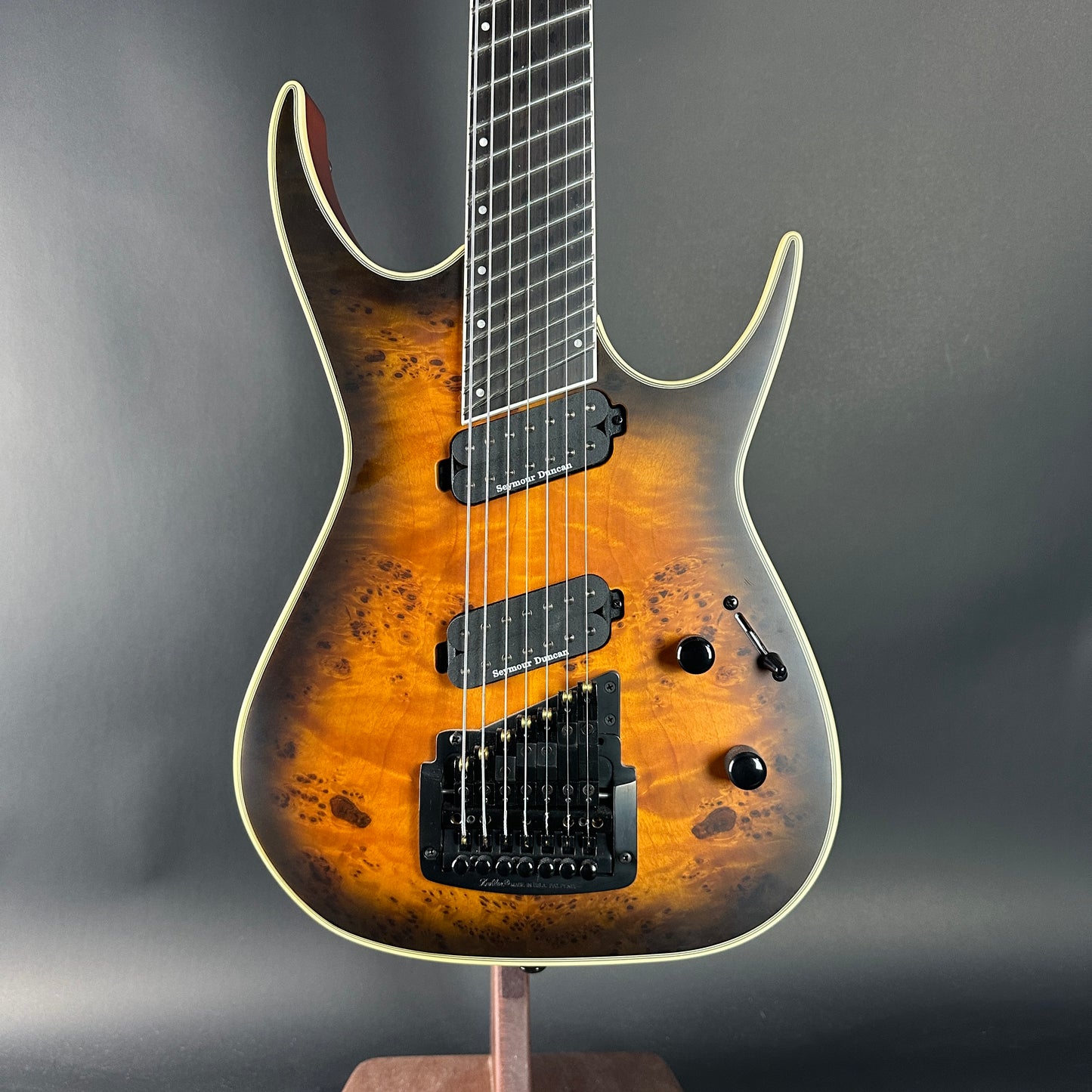 Electric guitar with a sunburst finish on a gray background