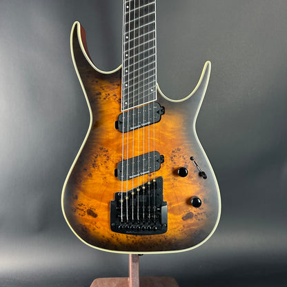 Electric guitar with a sunburst finish on a gray background