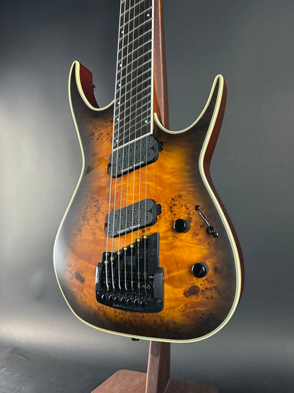 Electric guitar with a sunburst finish on a gray background