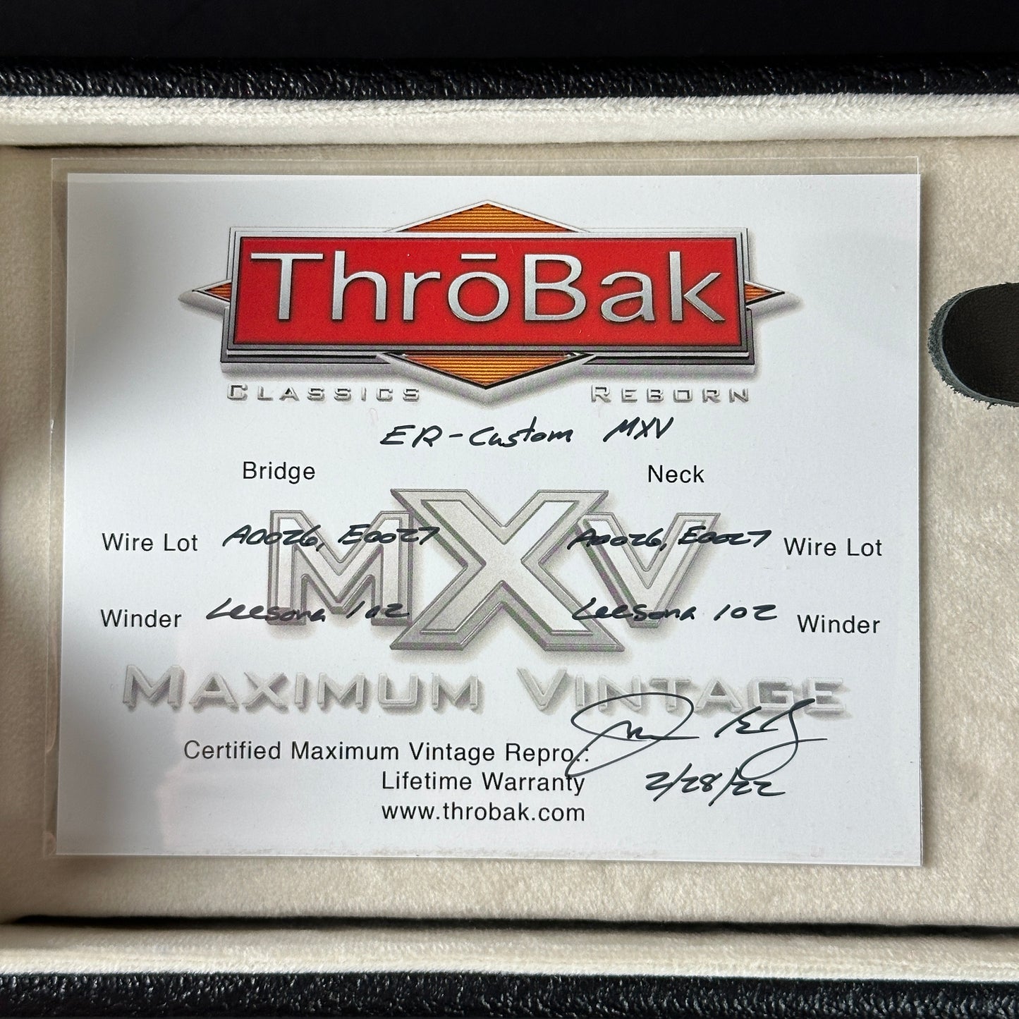 ThroBak Classics Reborn MXV certificate on a wooden surface