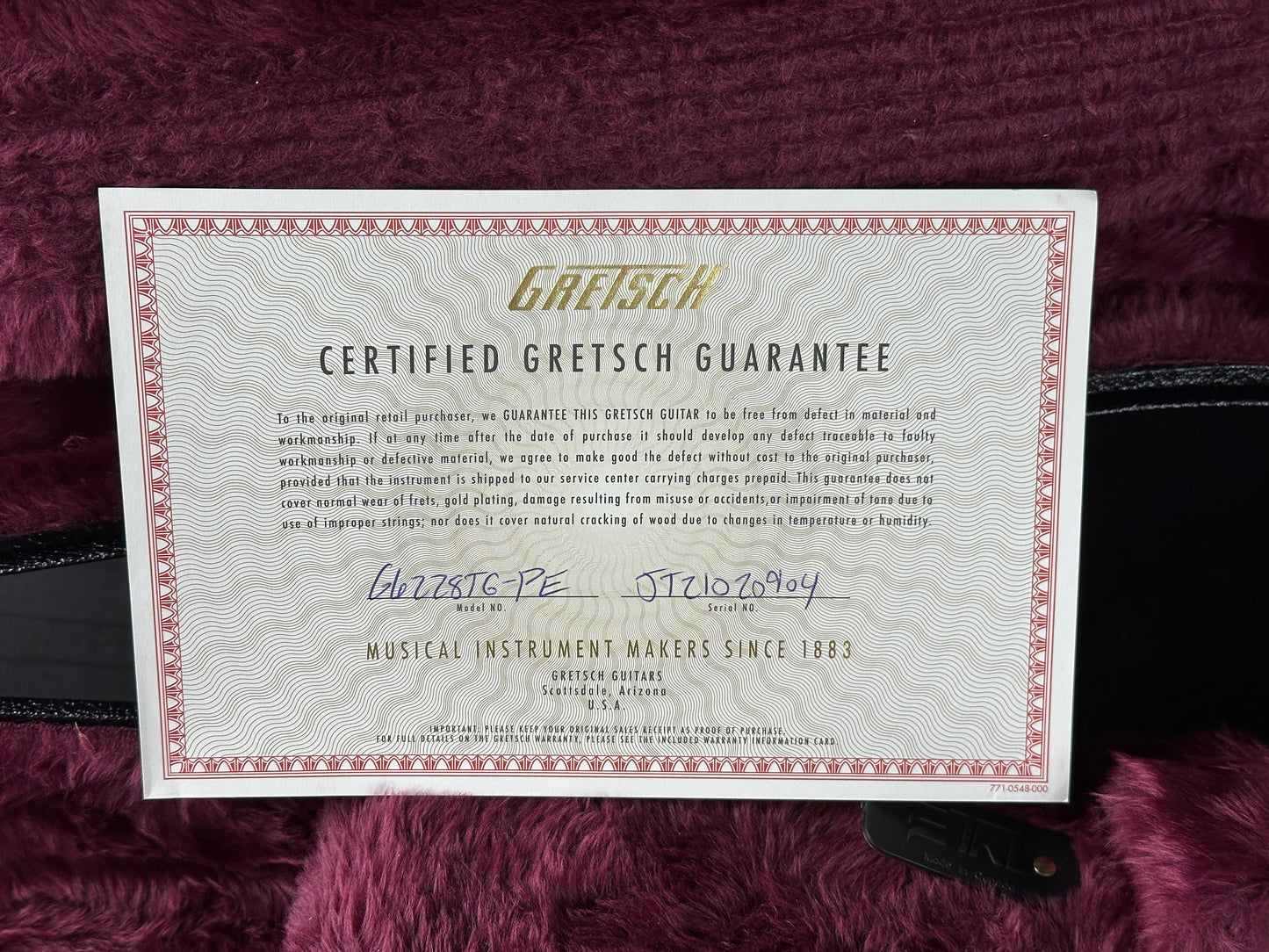 Gretsch Certified Gretsch Guarantee certificate on a maroon background