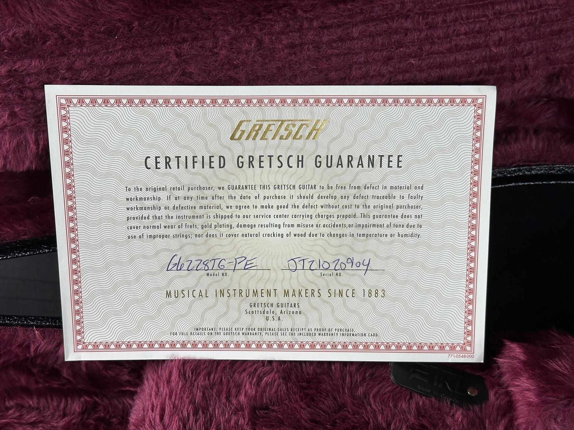 Gretsch Certified Gretsch Guarantee certificate on a maroon background
