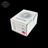 A white cardboard box with a printed black sun illustration and handwritten markings, photographed on a solid black background. A Tone Shop watermark is visible in the top-left corner.