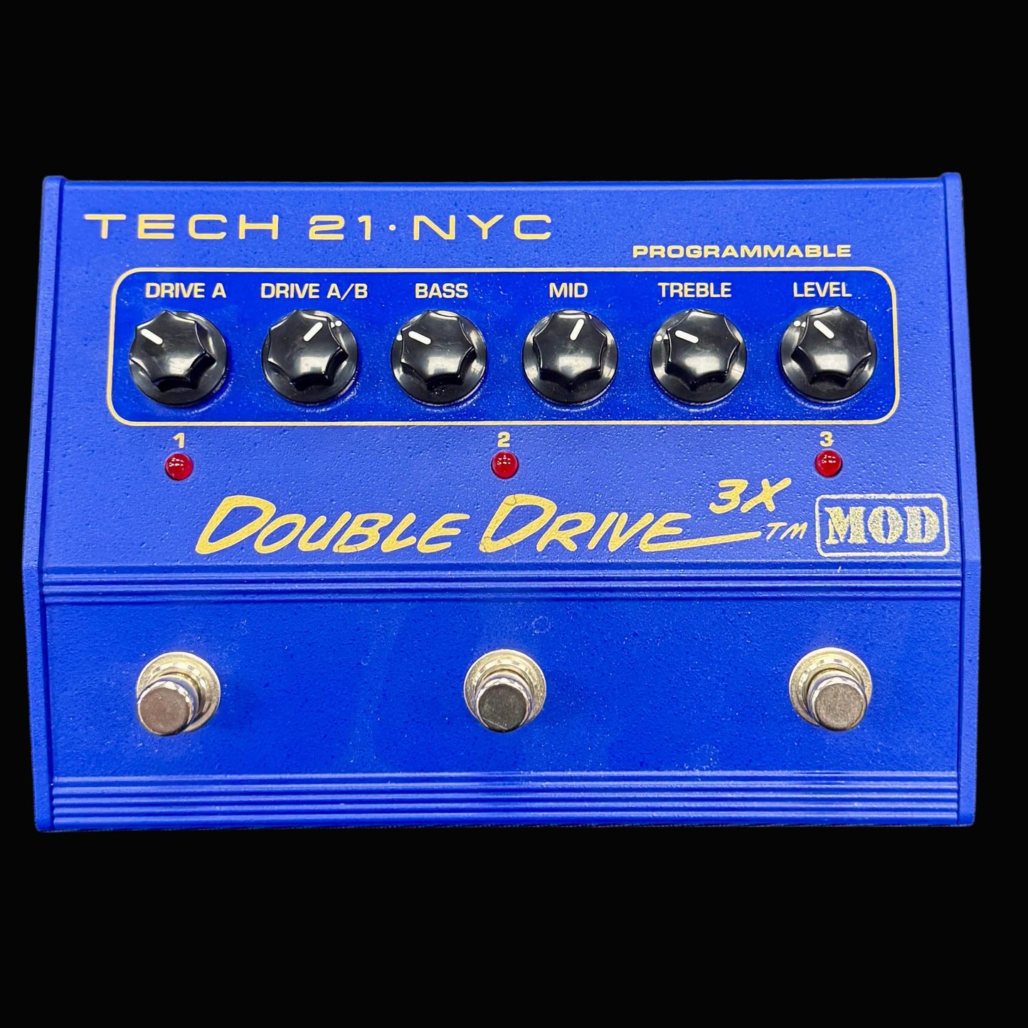 Blue guitar effects pedal with 'Tech 21 NYC' branding on a black background