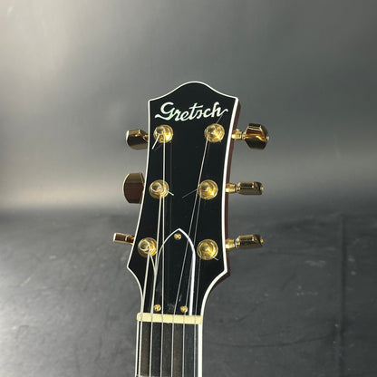 Gretsch guitar headstock on a dark background