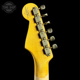 Close-up of a yellow guitar headstock with tuning pegs on a black background, featuring the 'Tone Shop' logo.