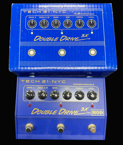 Blue guitar effects pedal with 'Tech 21 NYC' branding on a black background