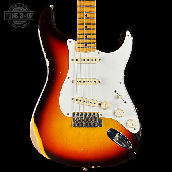 Fender Stratocaster guitar with sunburst finish on a black background