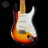 Fender Stratocaster guitar with sunburst finish on a black background