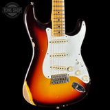 Electric guitar with a sunburst finish on a black background, featuring a 'Tone Shop' logo.