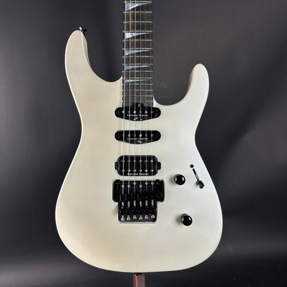 White electric guitar on a dark background