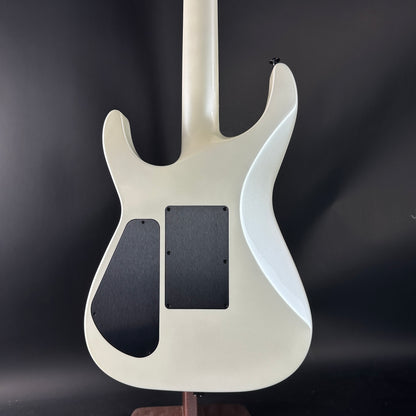 White electric guitar body on a dark background