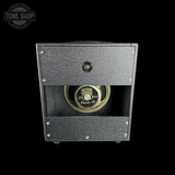 Guitar amplifier with Celestion speaker on a black background, featuring 'Tone Shop' logo.