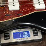 Fender Custom Shop 1962 Jazzmaster Journeyman Relic Black on scale displaying weight.