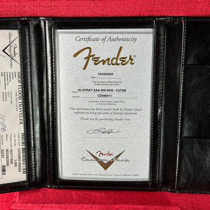 Fender certificate of authenticity in a black leather case on a red background