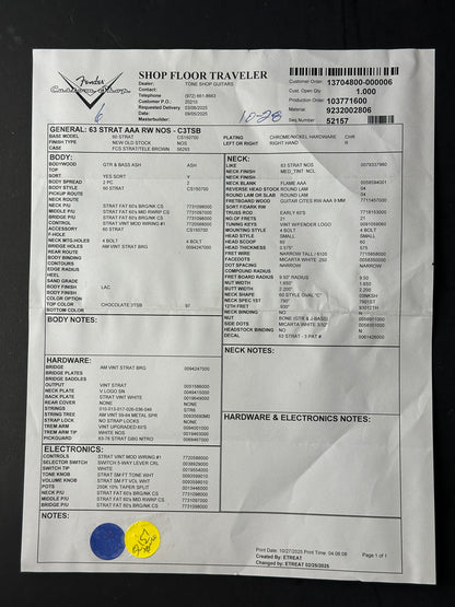 Sheet of paper with printed text and a few stickers on a dark background