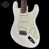 White electric guitar with a 'Tone Shop' logo in the corner