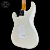 White electric guitar body with visible branding on a black background