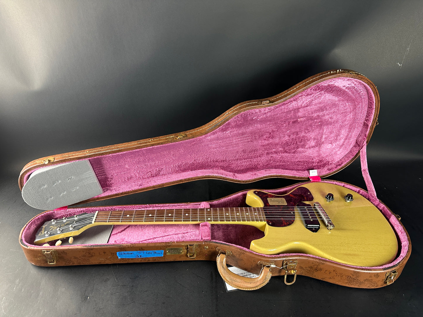 Electric guitar in a case on a dark background