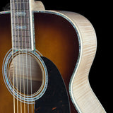 Front shoulder of Martin Custom Shop M/0000 42 Style Ambertone Adirondack/Pacific Big Leaf Flamed Maple.