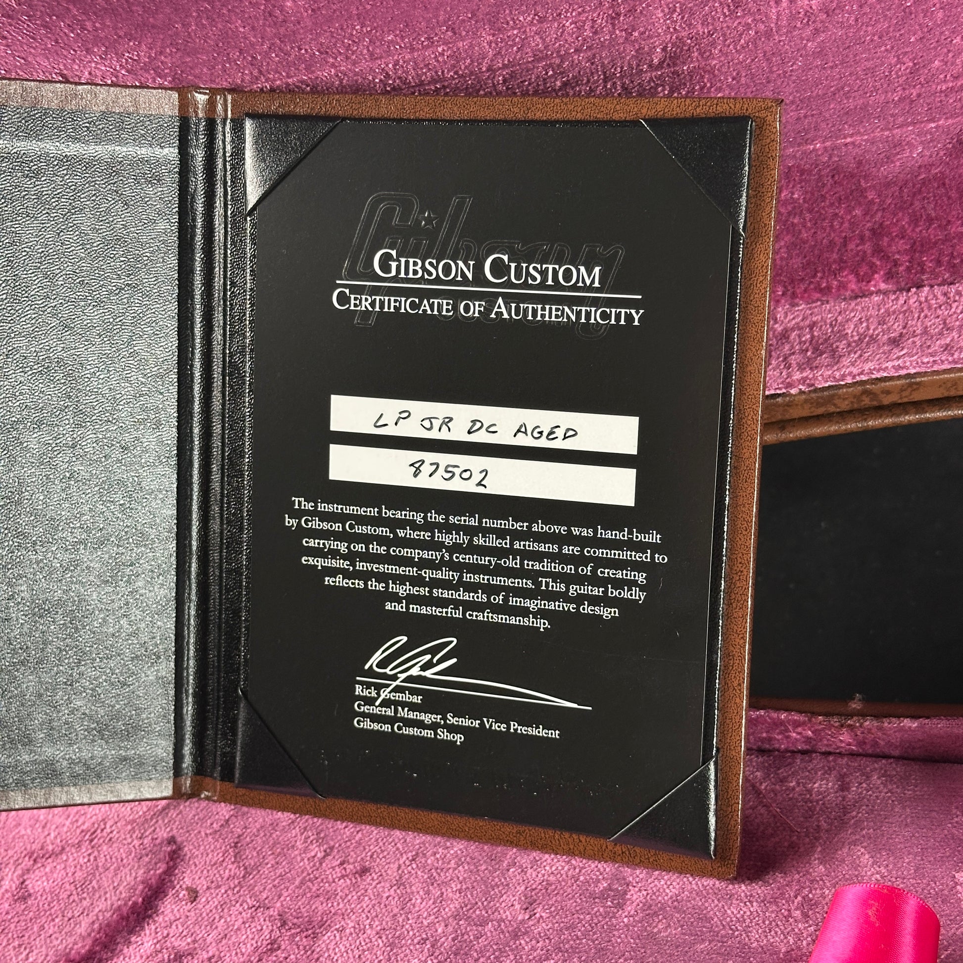 Gibson Custom Certificate of Authenticity on a pink background