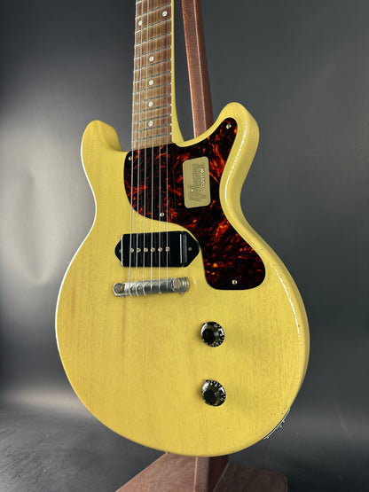 Electric guitar with a flame maple neck on a dark background