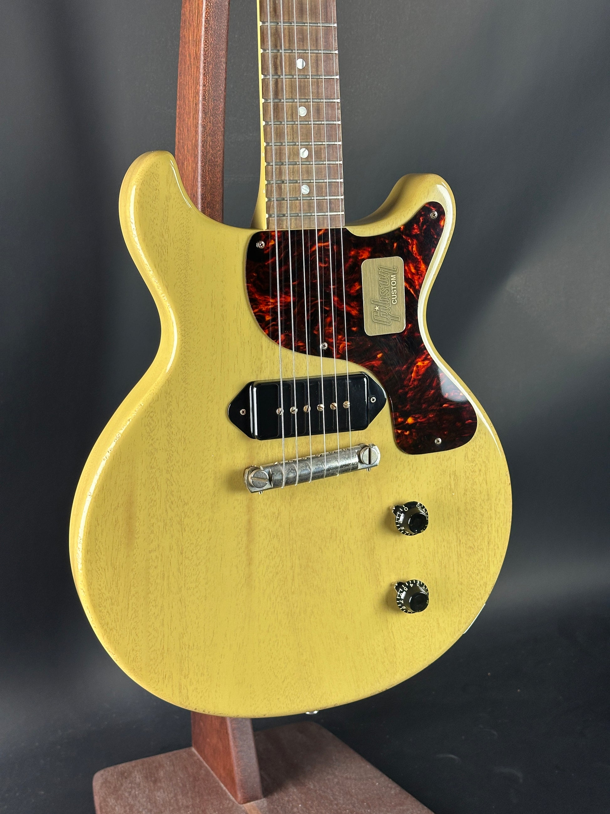 Electric guitar with a gold finish on a dark background