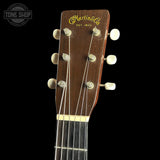 Guitar headstock with 'Martin & Co' branding on a black background