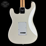 White electric guitar with a visible brand logo on a black background
