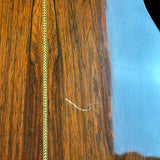 Close-up of a wooden surface with a blue edge