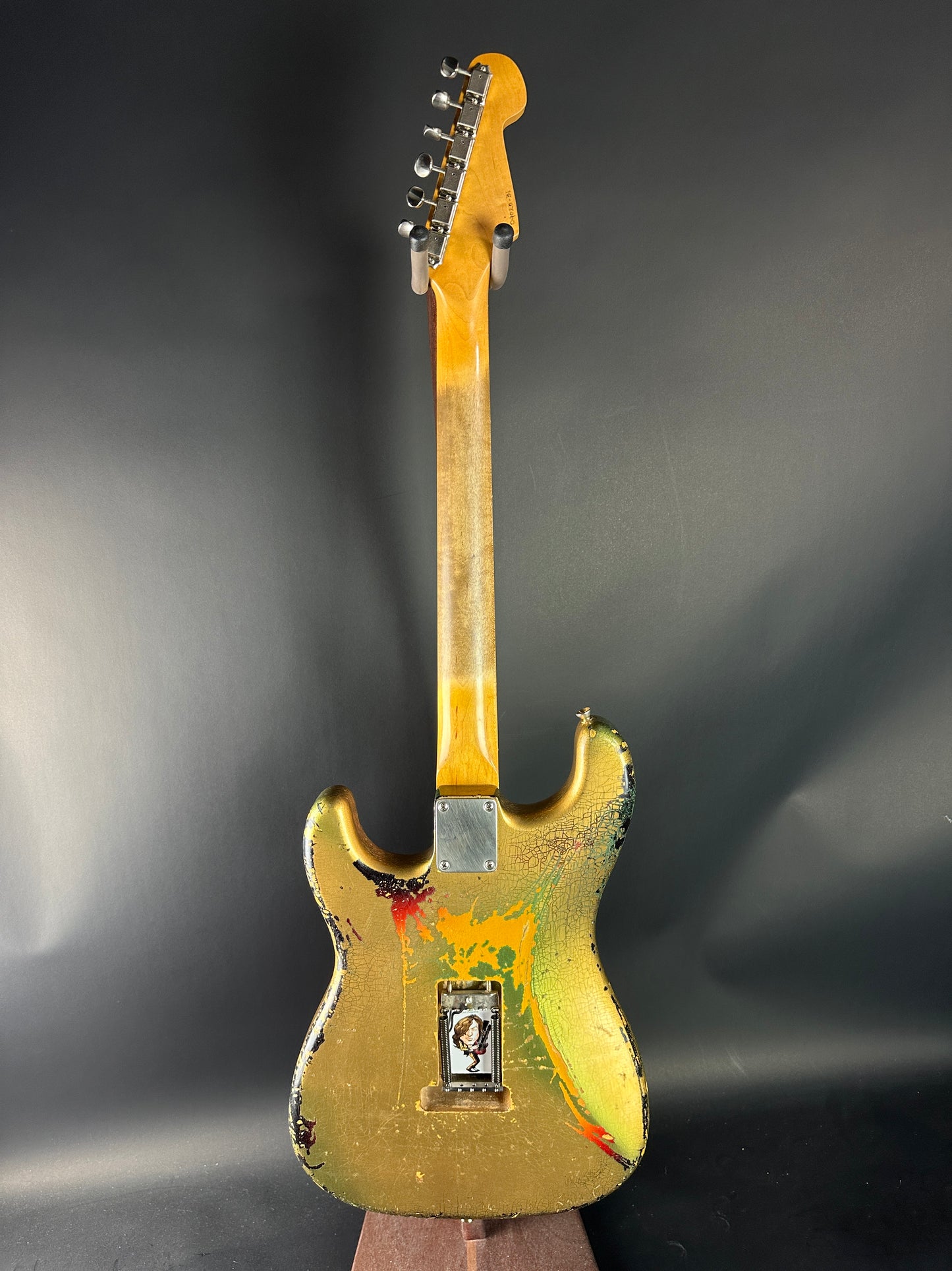 Yellow electric guitar on a dark background