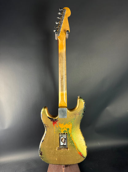 Yellow electric guitar on a dark background