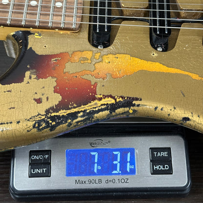 Guitar on a digital scale displaying weight