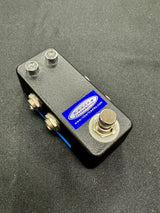 Small electronic device with screws on a gray background