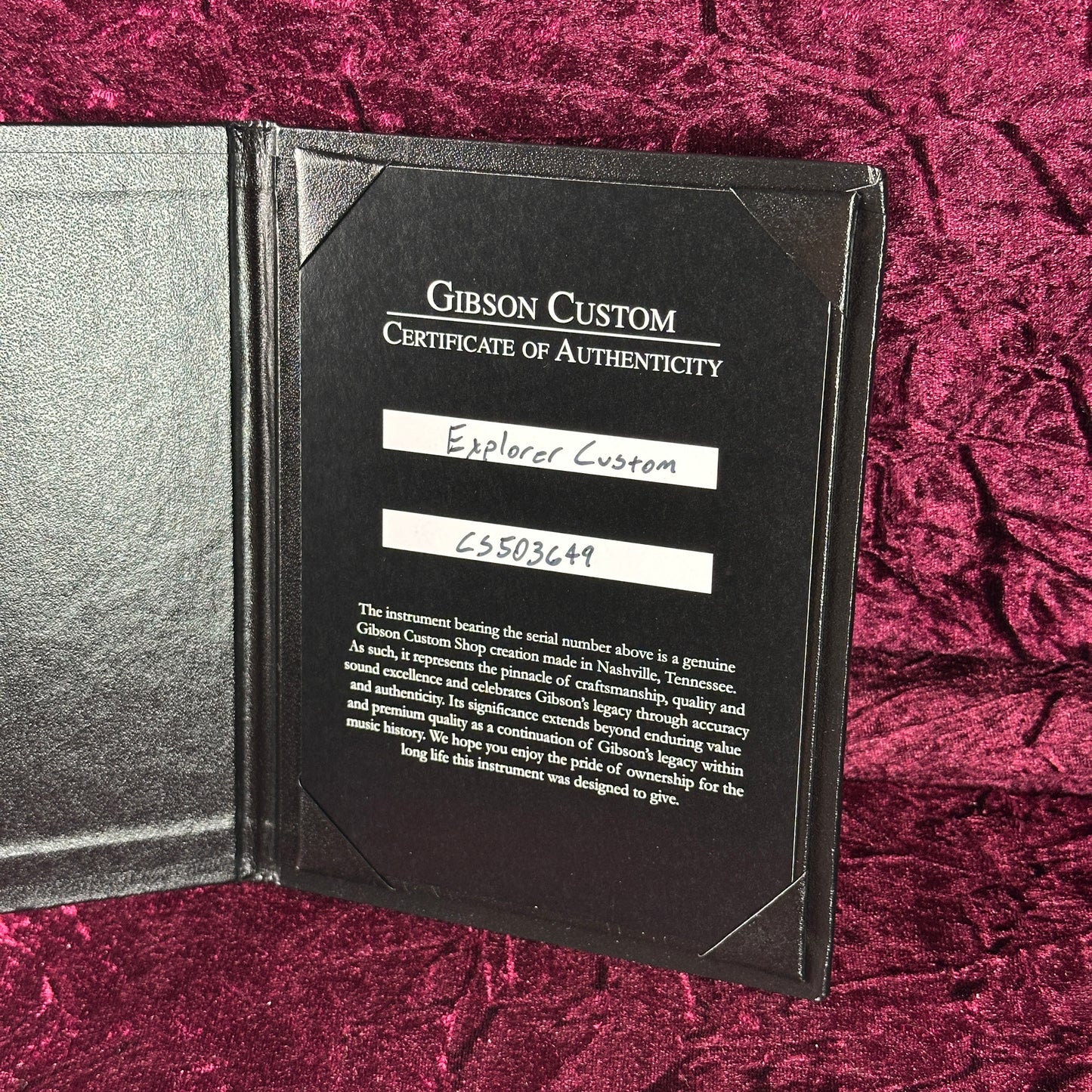 Gibson Custom Certificate of Authenticity on a textured red background