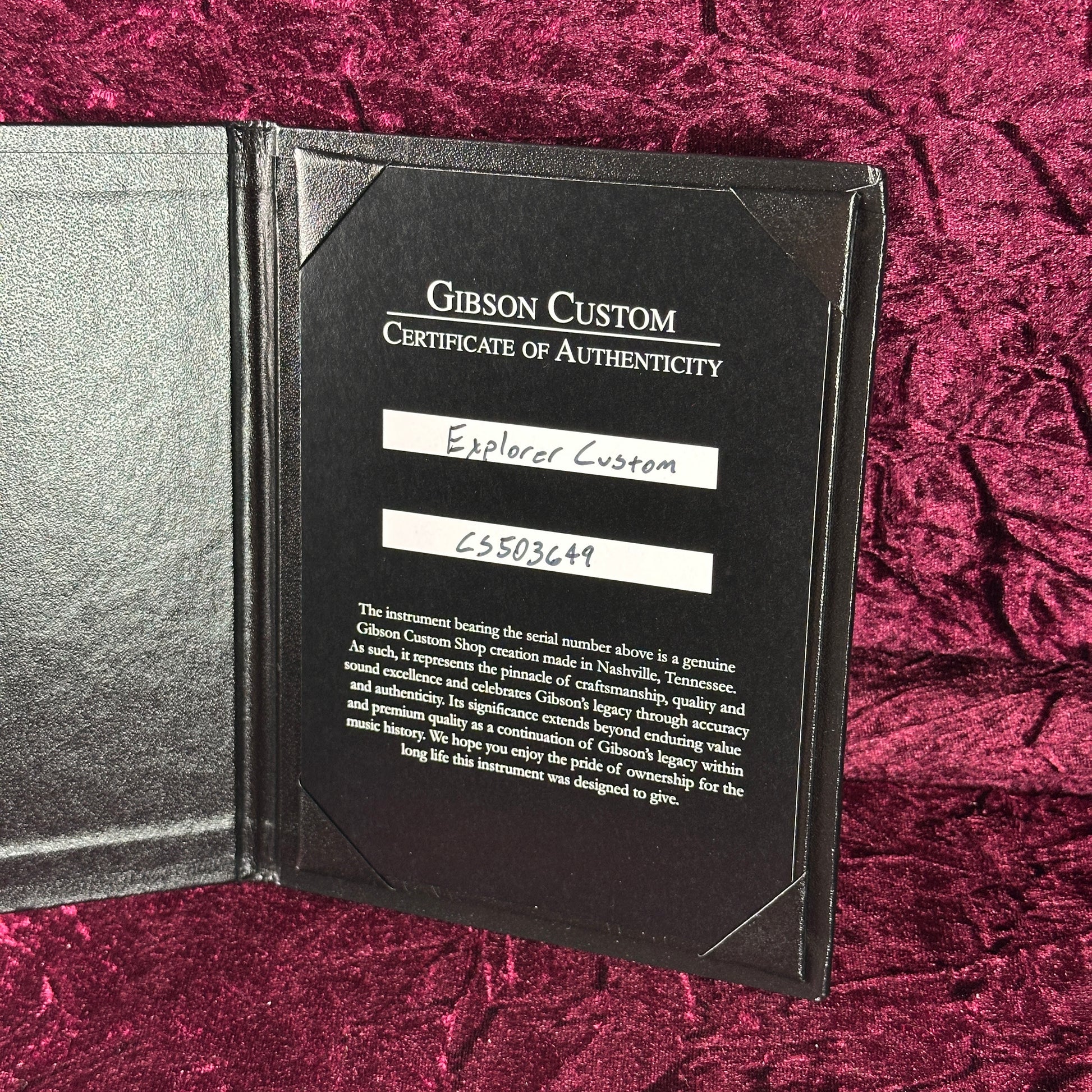 Gibson Custom Certificate of Authenticity on a textured red background