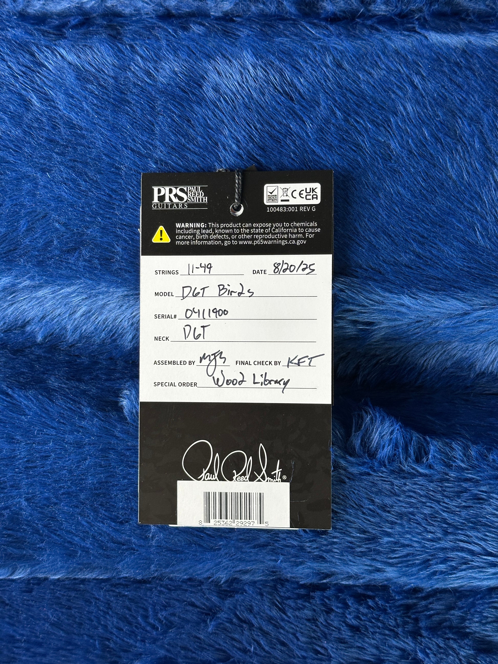 Close-up of a label on blue textured fabric