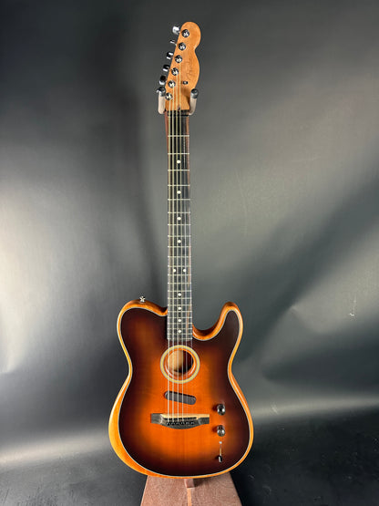 Acoustic guitar with a sunburst finish on a gray background