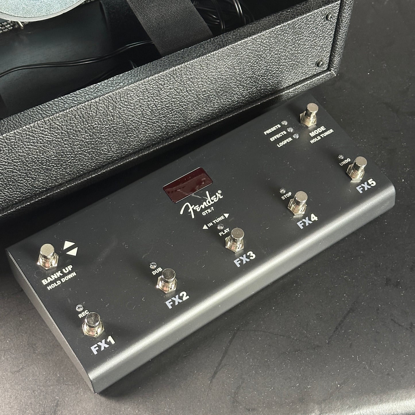 Fender guitar effects pedal on a dark surface